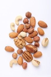 Photo of Mix of different nuts on white background, flat lay