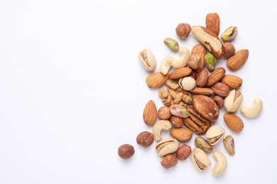 Photo of Mix of different nuts on white background, flat lay. Space for text