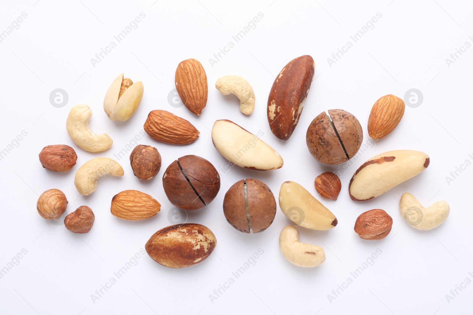 Photo of Mix of different nuts on white background, flat lay