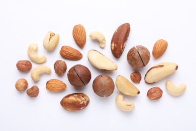Photo of Mix of different nuts on white background, flat lay