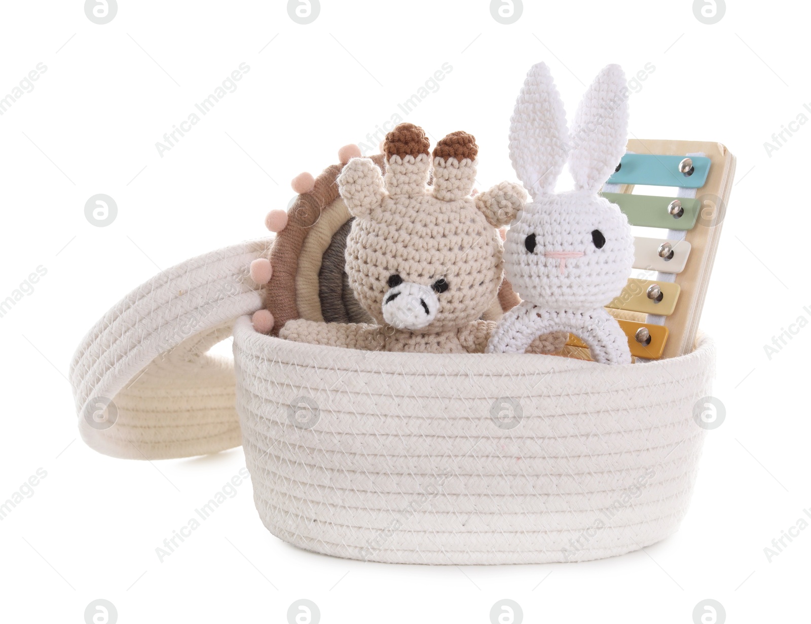Photo of Different toys in wicker basket isolated on white