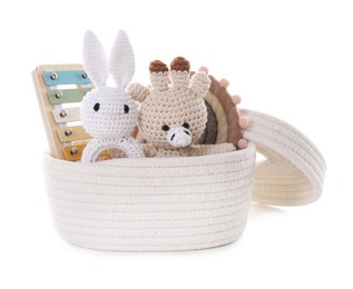 Photo of Different toys in wicker basket isolated on white