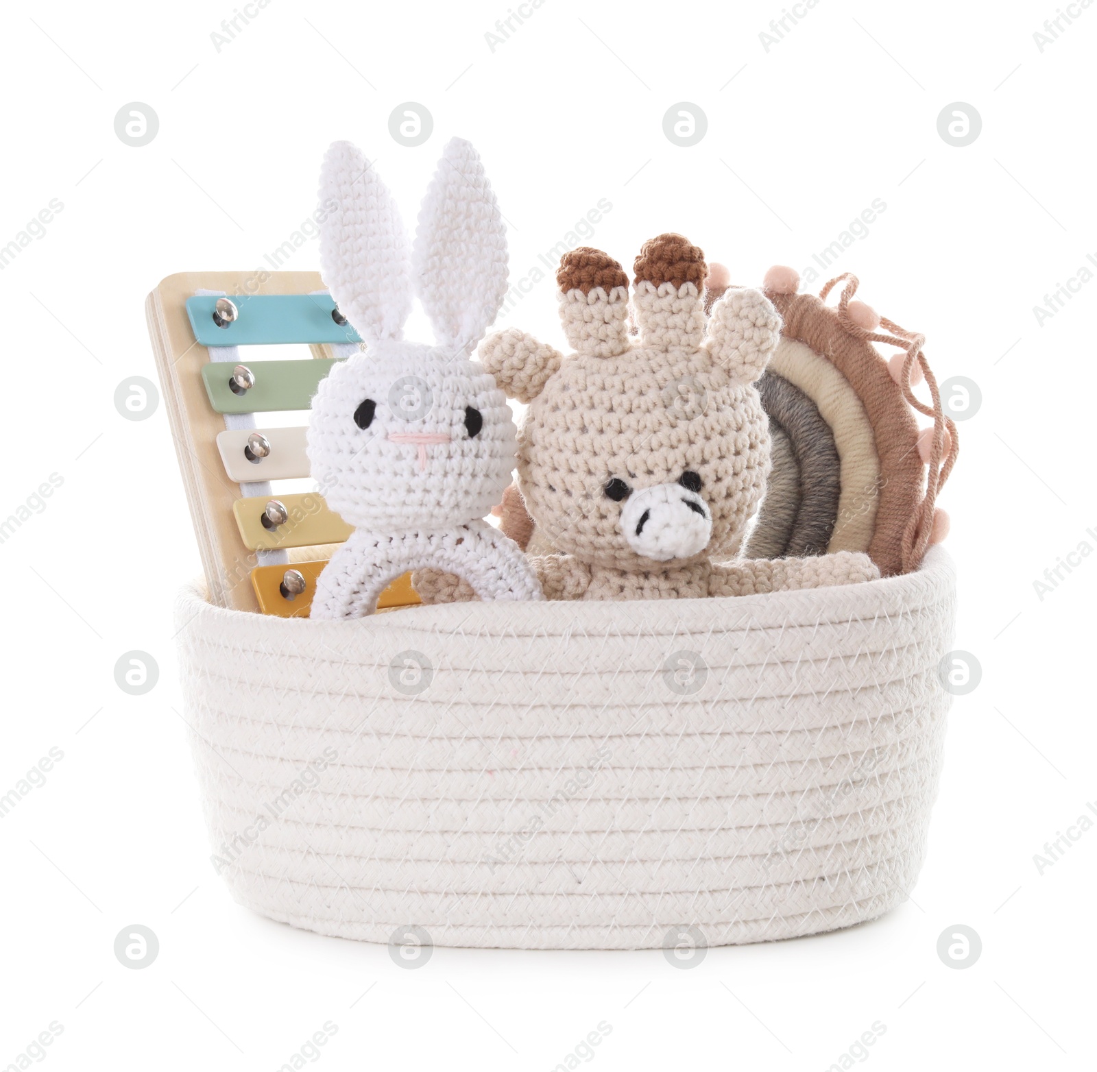 Photo of Different toys in wicker basket isolated on white