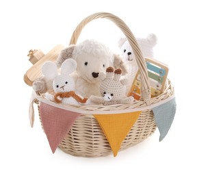 Photo of Different toys in wicker basket isolated on white