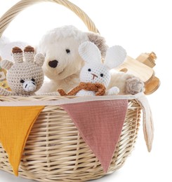 Photo of Different toys in wicker basket isolated on white