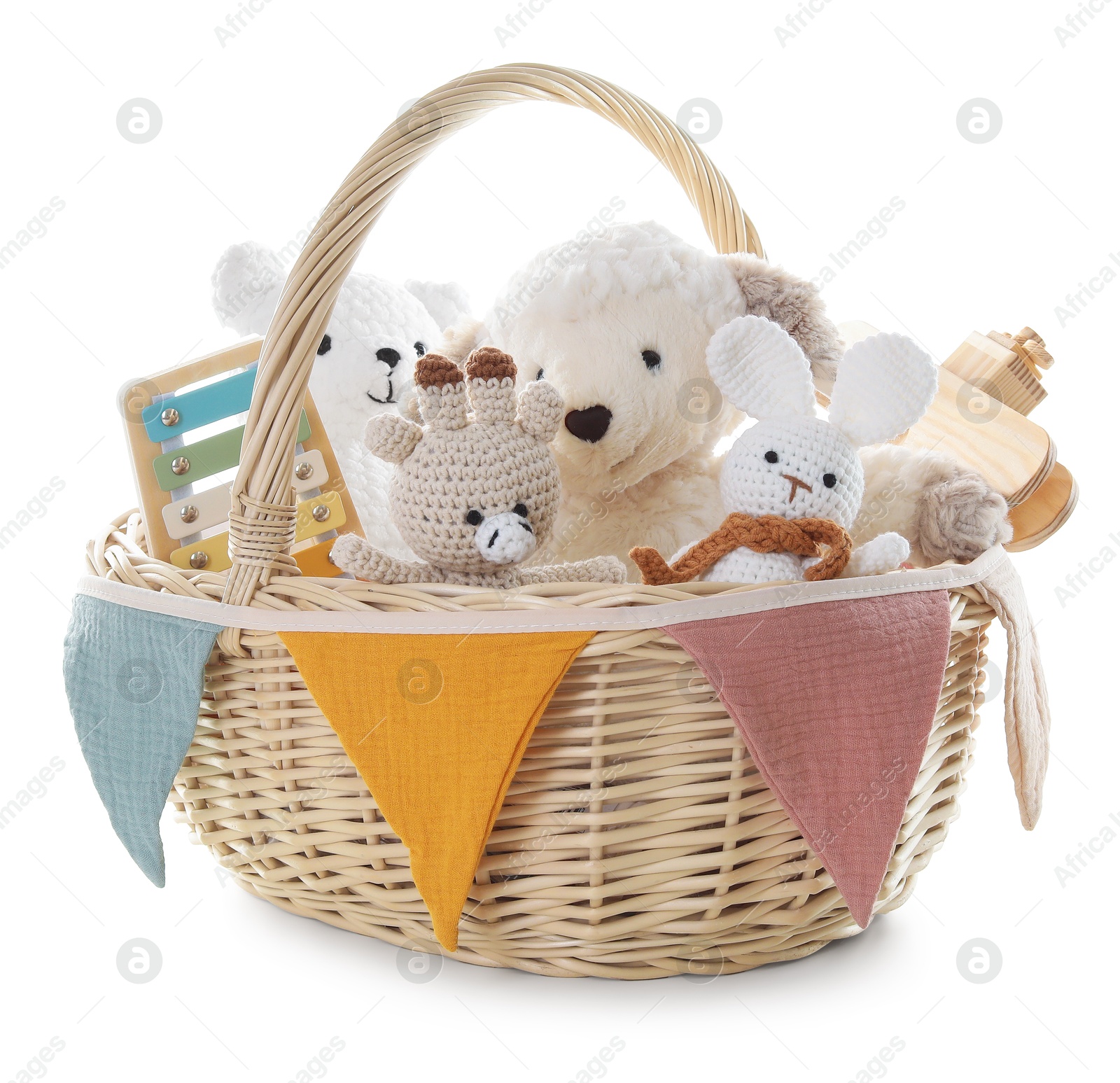 Photo of Different toys in wicker basket isolated on white