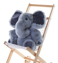 Photo of Toy elephant on stroller isolated on white