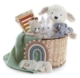 Photo of Different toys in wicker basket isolated on white