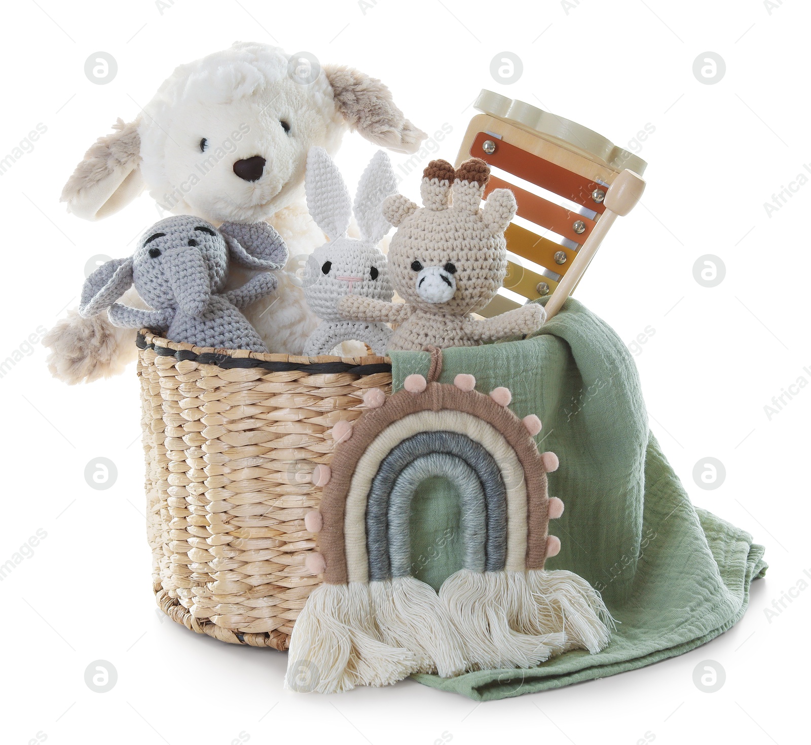 Photo of Different toys in wicker basket isolated on white