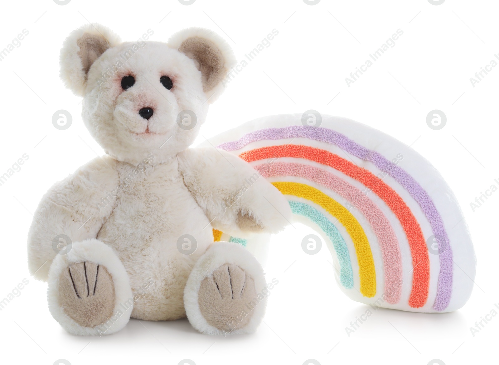 Photo of Toy rainbow and teddy bear isolated on white