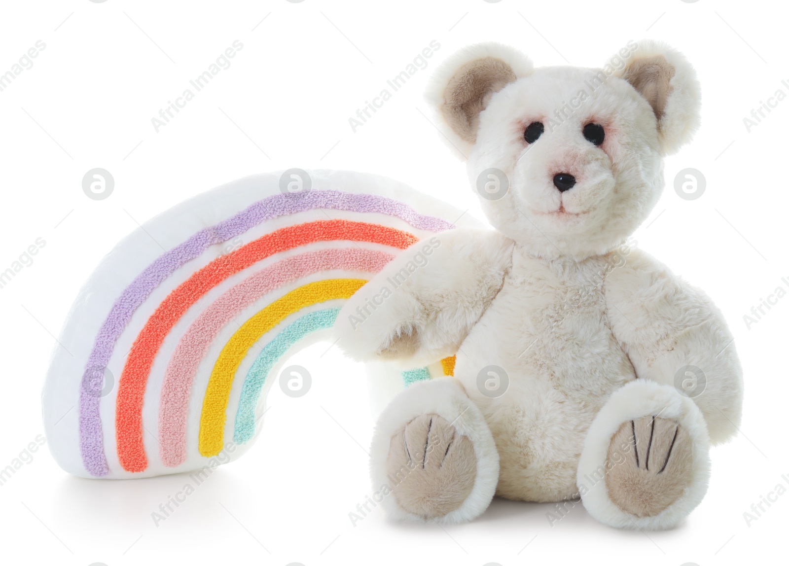 Photo of Toy rainbow and teddy bear isolated on white