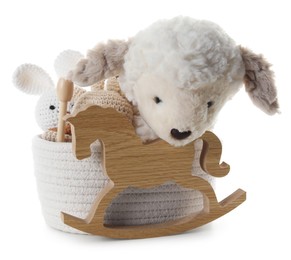 Photo of Different toys in wicker basket isolated on white