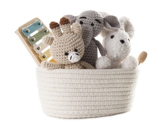 Photo of Different toys in wicker basket isolated on white