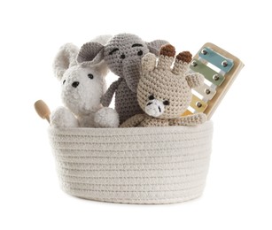 Photo of Different toys in wicker basket isolated on white