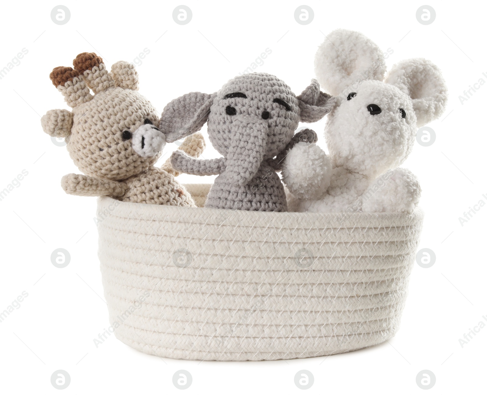 Photo of Different soft toys in wicker basket isolated on white
