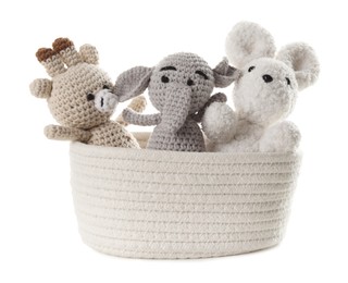 Photo of Different soft toys in wicker basket isolated on white