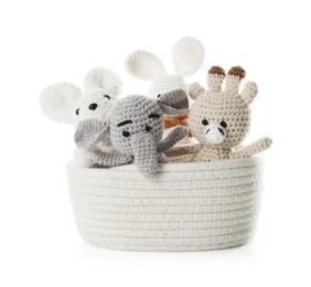 Photo of Different soft toys in wicker basket isolated on white