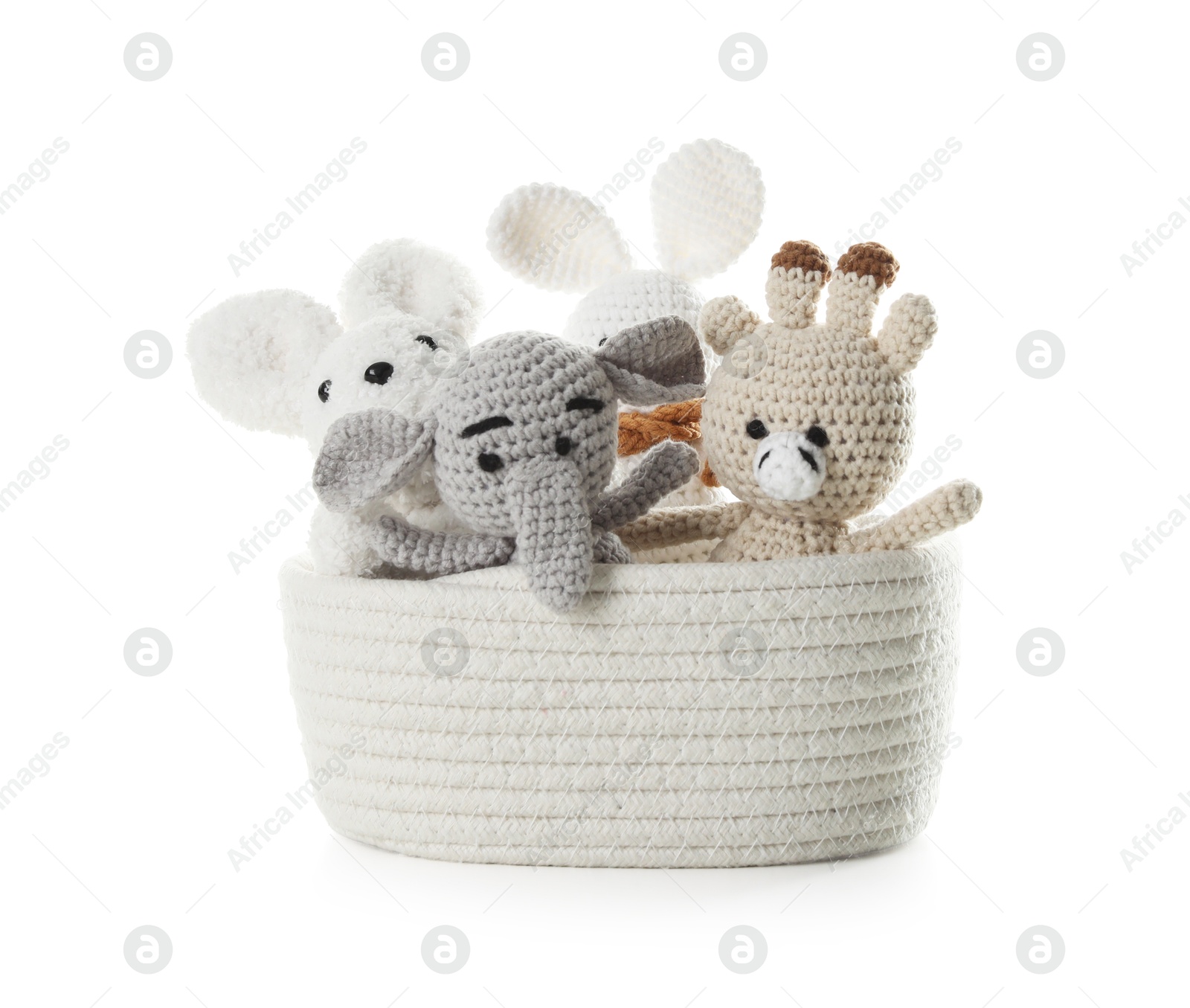 Photo of Different soft toys in wicker basket isolated on white