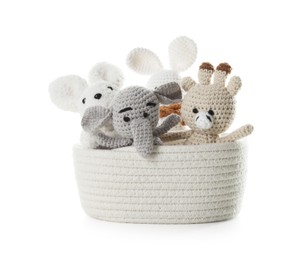 Photo of Different soft toys in wicker basket isolated on white