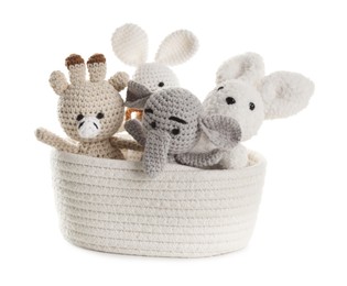 Photo of Different soft toys in wicker basket isolated on white