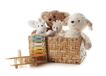 Photo of Different toys in wicker basket isolated on white