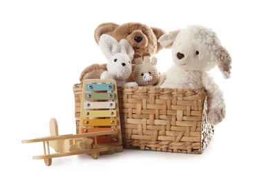 Photo of Different toys in wicker basket isolated on white