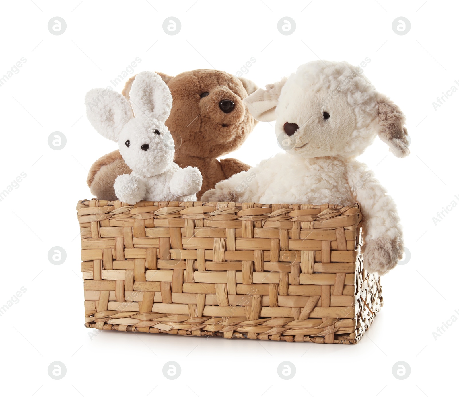 Photo of Different soft toys in wicker basket isolated on white