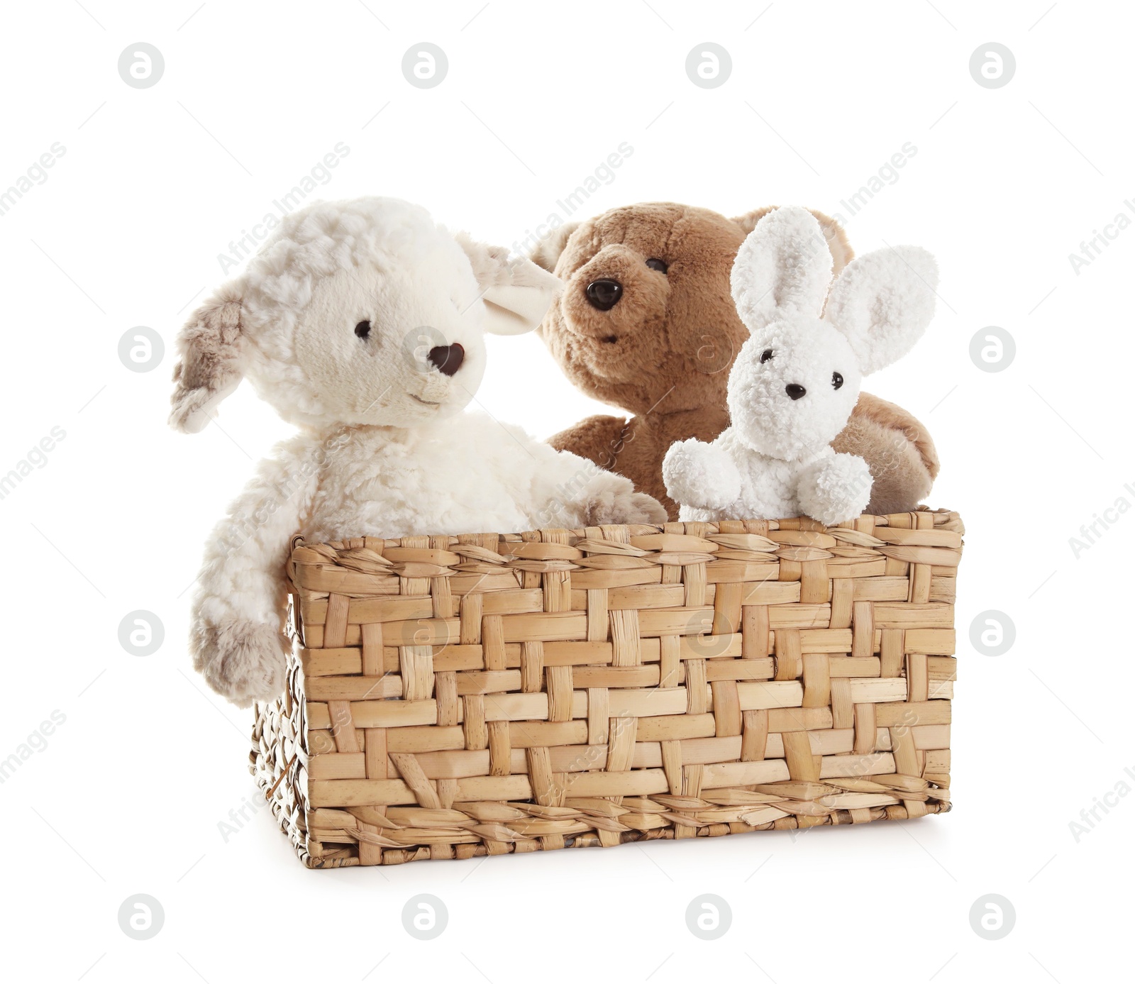 Photo of Different soft toys in wicker basket isolated on white