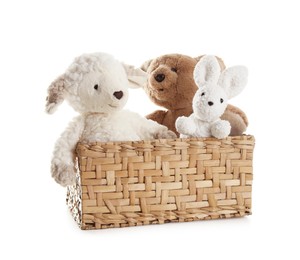 Photo of Different soft toys in wicker basket isolated on white