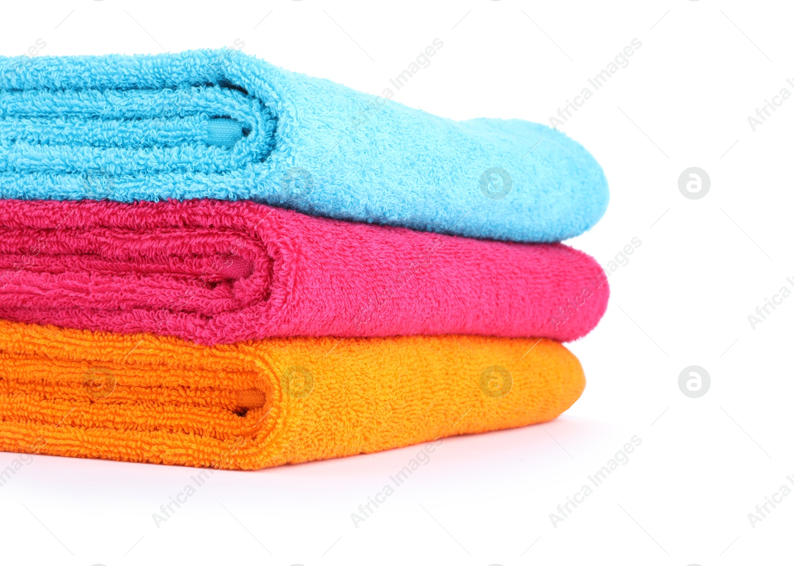 Photo of Stack of bright terry towels isolated on white