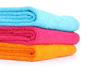 Photo of Stack of bright terry towels isolated on white