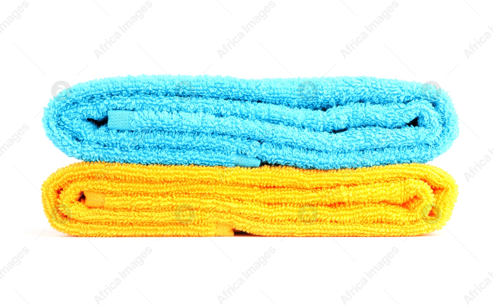 Photo of Stack of bright terry towels isolated on white