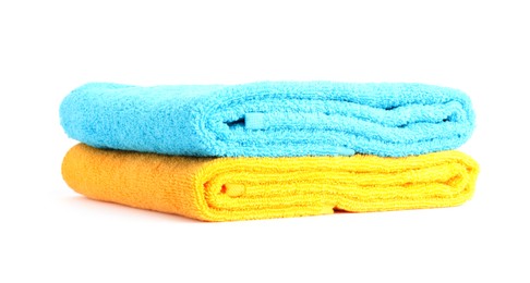 Photo of Stack of bright terry towels isolated on white