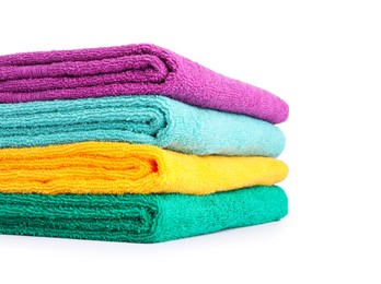 Photo of Stack of bright terry towels isolated on white