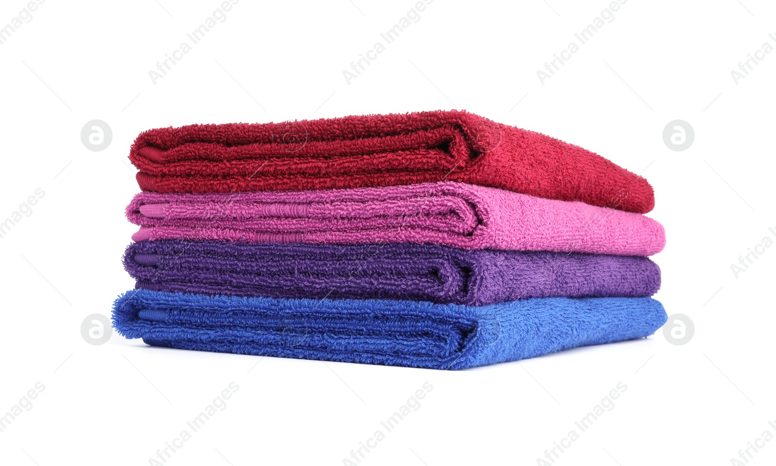 Photo of Stack of bright terry towels isolated on white