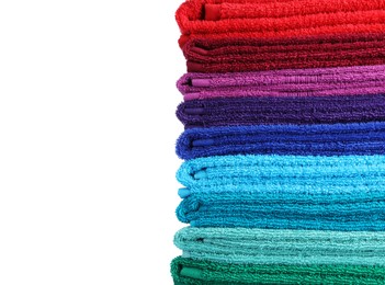 Photo of Stack of bright terry towels isolated on white