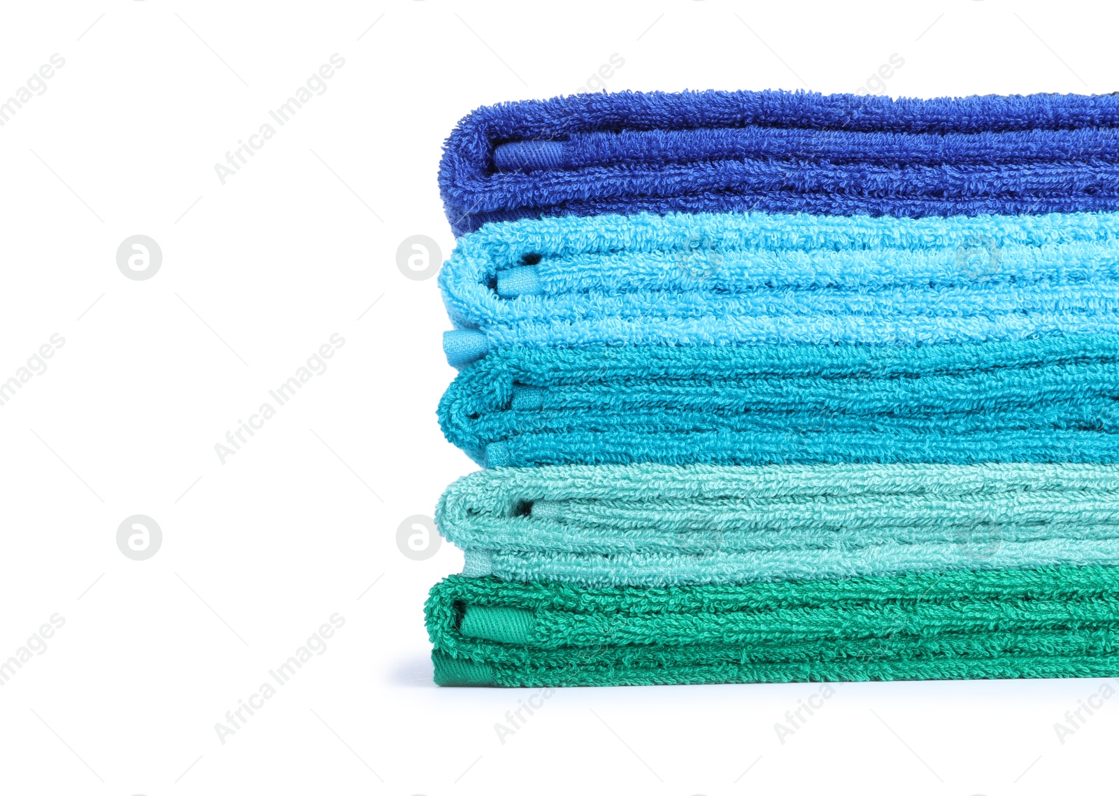 Photo of Stack of bright terry towels isolated on white