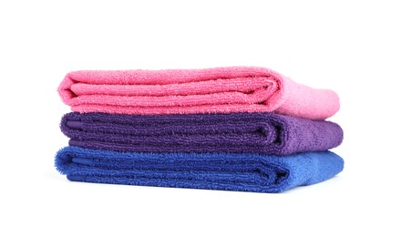 Photo of Stack of bright terry towels isolated on white