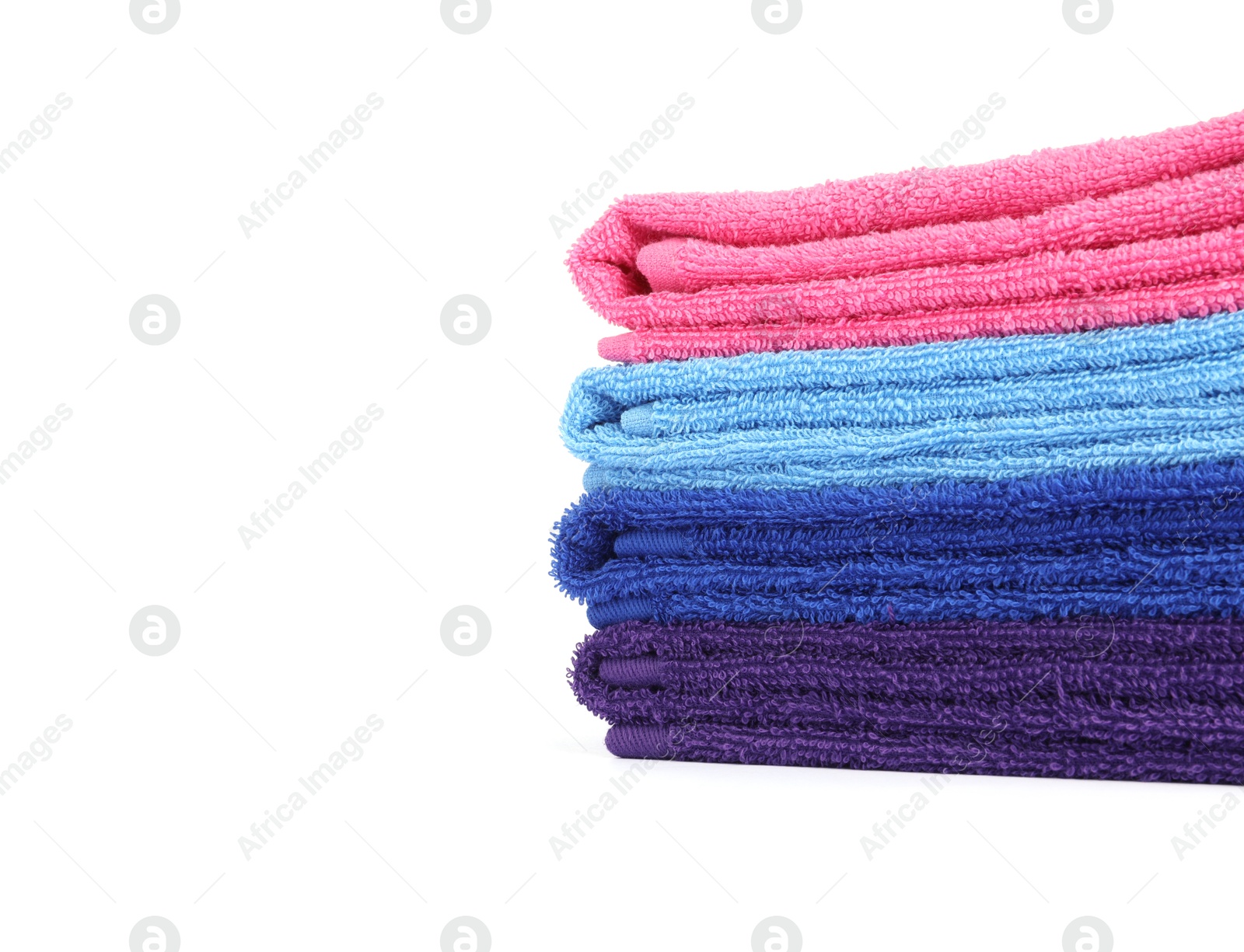 Photo of Stack of bright terry towels isolated on white