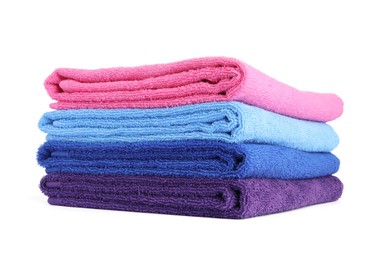 Photo of Stack of bright terry towels isolated on white