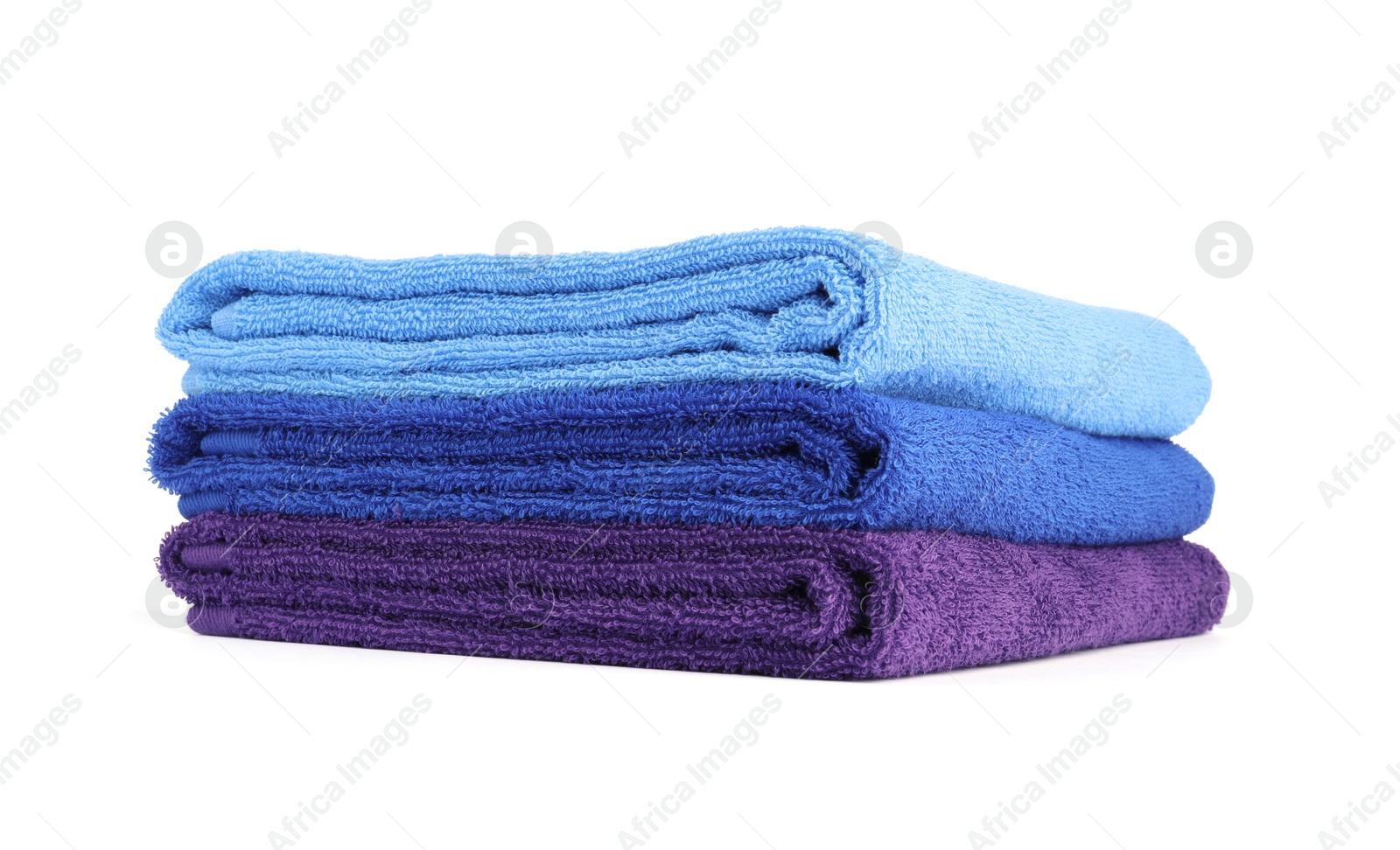 Photo of Stack of bright terry towels isolated on white