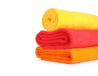 Photo of Stack of bright terry towels isolated on white