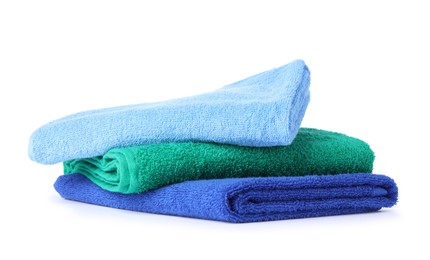Photo of Stack of bright terry towels isolated on white