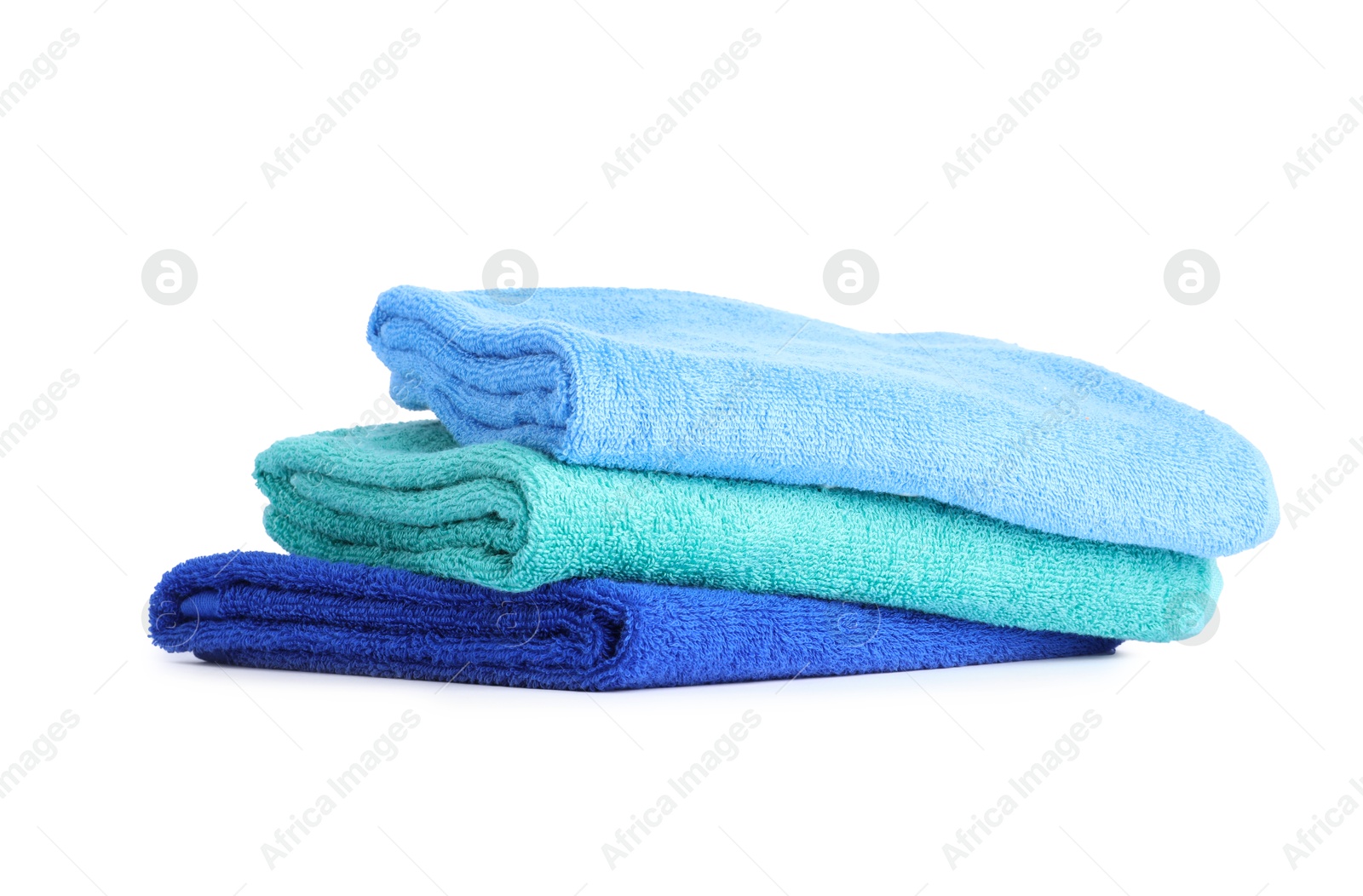 Photo of Stack of bright terry towels isolated on white