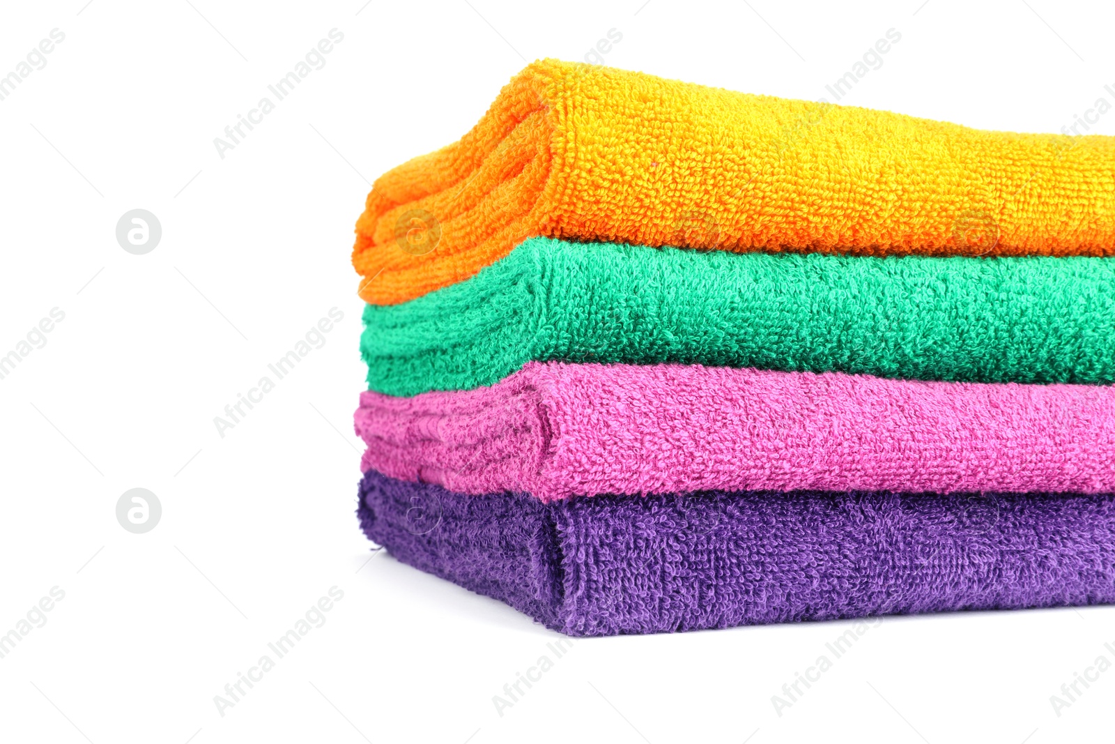 Photo of Stack of bright terry towels isolated on white