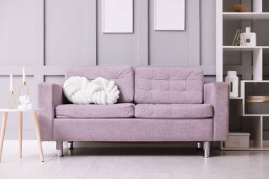 Photo of Comfortable gray sofa with cushions indoors. Interior design