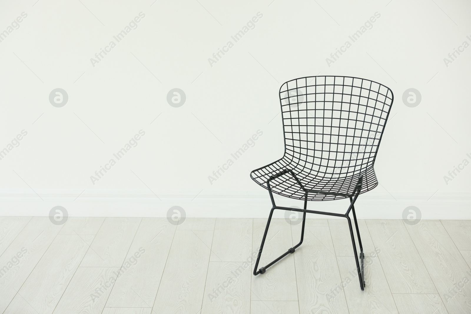 Photo of Stylish metal chair in room, space for text