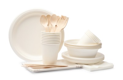 Photo of Set of disposable tableware isolated on white