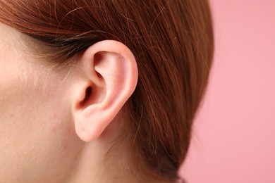Photo of Sound. Woman on pink background, closeup view