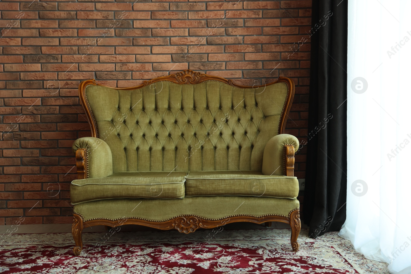 Green retro sofa in room. Interior design Photo of Green retro sofa in room. Interior design